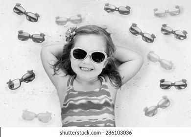 Choosing Baby Girl With Sunglasses photo 1